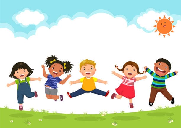 Happy nursery children jumping and playing together in a sunny meadow